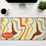 Retro 70s Abstract Marble Swirl Cream Orange Brown Desk Mat<br><div class="desc">Immerse yourself in a dance of colors with our Abstract Retro Modern Liquid Marble Wave Pattern. Evoking the dynamic fluidity of marbled surfaces and the charming aesthetics of retro-modern design, this pattern is a feast for the eyes. A symphony of vibrant colors swirls and flows in wave-like motions, creating a...</div>