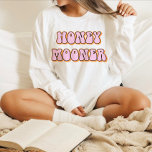 Retro 70's Themed Honeymooner Bride T-Shirt<br><div class="desc">Honeymooner bride t shirt featuring a retro 70's themed font with retro pink orange coloring. This shirt makes the perfect gift for a bride-to-be, bridal shower or bachelorette weekend celebration so she can wear it on her honeymoon. Colors are editable! Click 'edit design' to create your own colors. ©Marisu Valencia...</div>