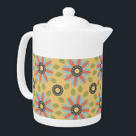 Retro Abstrat Blue and Coral Daisies Pattern Teapot<br><div class="desc">Minimalist yet cute are the words that come to mind as you look upon this sweet retro abstract blue and bright coral daisies on a yellow background amid a sprinkling of green leaves repeating pattern. Oh so adorable and super sweet as well. This classic abstract floral pattern translates perfectly to...</div>