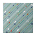 Retro Airplane Pattern Ceramic Tile<br><div class="desc">Fasten your seatbelt. This Retro Airplane Pattern Ceramic Tile is ready for takeoff. The design features lines of red, royal blue, and white, mid century modern airplanes flying across a steel blue background. Thin stripes of orange, lime green and grey, as well as lines of teal dots, add interest to...</div>