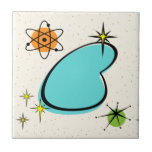 Retro Atomic Boomerang Ceramic Tile<br><div class="desc">This Retro Atomic Boomerang and Starbursts pattern is the epitome of mid-century modern. With its large turquoise boomerang surrounded by kitschy starbursts and orange and green circles for some extra whimsy, this vintage inspired pattern is mod enough to be stylish and retro enough to be classic. Be the coolest cat...</div>