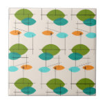 Retro Atomic Mobile Pattern Ceramic Tile<br><div class="desc">This Retro Atomic Mobile Pattern Ceramic Tile is mid century modern style at its finest. The vintage inspired design features a cream background with colorful pointed ovals in turquoise, orange, teal, and avocado green. The teal and avocado green ovals overlap creating a lovely shade of peacock blue. Fun starbursts accentuate...</div>