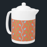 Retro Blue & Green Vines on Orange Floral Pattern Teapot<br><div class="desc">Folksy and fun are the words that come to mind as you look upon this sweet retro blue and green vines on a orange background floral pattern. Oh so adorable and super cute as well. This classic minimalist vine pattern translates perfectly to both fashion and home decor items. The perfect...</div>