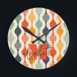 Retro Groovy Pattern Round Clock<br><div class="desc">Your monogram and first name highlight a retro mod circle pattern in a groovy color palette,  this wall clock is fun for you,  your kids,  and college dorm rooms or give as a gift. (You can remove the monogram and first name,  just leave the personalization blank.)</div>