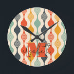 Retro Groovy Pattern Round Clock<br><div class="desc">Your monogram and first name highlight a retro mod circle pattern in a groovy color palette,  this wall clock is fun for you,  your kids,  and college dorm rooms or give as a gift. (You can remove the monogram and first name,  just leave the personalization blank.)</div>