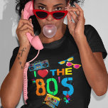 Retro I Love The 80s | Eighties T-Shirt<br><div class="desc">Fun and colorful 80's black t-shirt featuring bright neon colored text saying "i love the eighties",  a cassette tape,  bright retro sunglasses,  a ghetto blaster (boombox),  and a few scattered stars.</div>