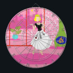 Retro In the Pink Dart Board<br><div class="desc">This Retro In the Pink Dart Board looks like a scene out of a 1960's romantic comedy. The minimalist design shows a sophisticated woman in her ultra kitschy and ultra pink, penthouse apartment. The room features a pink brick wall with white grout lines. In front of the wall, there is...</div>