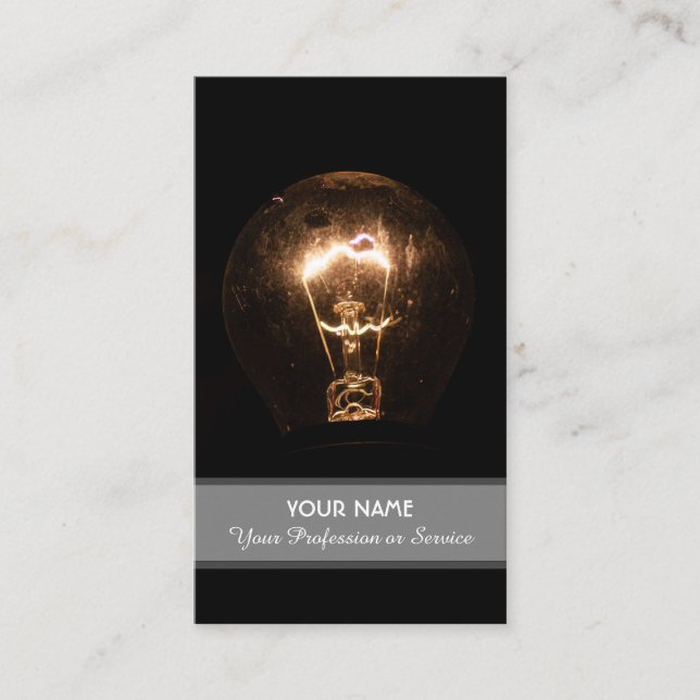 Retro light bulb illuminates the dark business card (Front)