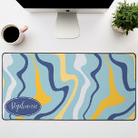 Retro Modern Abstract Marble Swirl Blue And Yellow Desk Mat<br><div class="desc">Immerse yourself in a dance of colors with our Abstract Retro Modern Liquid Marble Wave Pattern. Evoking the dynamic fluidity of marbled surfaces and the charming aesthetics of retro-modern design, this pattern is a feast for the eyes. A symphony of vibrant colors swirls and flows in wave-like motions, creating a...</div>
