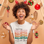 Retro mummy believes Santa Claus Christmas family T-Shirt<br><div class="desc">With its retro font style and vibrant colors,  this Christmas t-shirts bring a jolly vintage vibe to your festivities. The wording reads "Mummy believes in Santa Claus"</div>