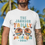 Retro palm trees sunglasses groovy family vacation T-Shirt<br><div class="desc">Get ready to groove in style with this customizable family vacation t-shirt! Embrace the sun-soaked vibes with a vibrant sunglasses illustration, accompanied by swaying palm trees. The caption "family vacation" pops in a colorful retro font, adding a touch of nostalgia to your getaway. Personalize it with your family name and...</div>