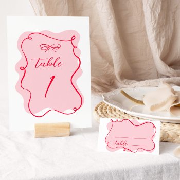 Retro Pink And Red Wavy Frame Wedding Table Number by JermolinaArtLTD at Zazzle