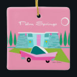 Retro Pink Palm Springs Ceramic Ornament<br><div class="desc">Between the pink background, turquoise mid century modern home, and the classic 1950s car, this design couldn’t be more Palm Springs if it said it in the clouds. Oh, wait, it does say it in the clouds! The blue and teal stone of the house is offset by the sputnik light...</div>
