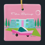 Retro Pink Palm Springs Ceramic Ornament<br><div class="desc">Between the pink background, turquoise mid century modern home, and the classic 1950s car, this design couldn’t be more Palm Springs if it said it in the clouds. Oh, wait, it does say it in the clouds! The blue and teal stone of the house is offset by the sputnik light...</div>
