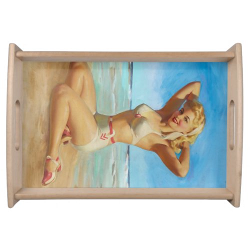 Retro pinup girl at the beach serving tray