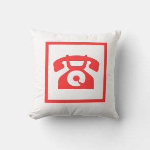 retro red phone on white pillow