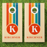 Retro Stripes Orange Monogram Family Name Cornhole Set<br><div class="desc">Add a touch of retro charm to your outdoor gatherings with this custom cornhole set featuring bold orange stripes and a personalized monogram. Perfect for family events, backyard parties, or summer picnics, this set is designed with vibrant retro colors that bring a fun, nostalgic vibe. Customize it with your family...</div>