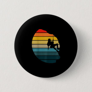 Retro sunset rock climbing backpacker mountain button
