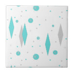 Retro Turquoise Diamonds & Starbursts Ceramic Tilw Tile<br><div class="desc">This Retro Turquoise Diamonds and Starbursts Ceramic Tile is a new take on a vintage style. It features kitschy, grey starbursts on turquoise polka dots, surrounding geometric, turquoise and grey diamond shapes. Customize the background color on this mid century modern product if you're feeling daring, or leave it white if...</div>