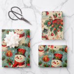 Retro Vintage Christmas: Frosty Snowmen  Wrapping Paper Sheets<br><div class="desc">This vintage style Christmas wrapping paper with snowmen features a charming and nostalgic design. The starry light blue background sets a wintry tone,  reminiscent of a clear,  cold night sky. The snowmen on the wrapping paper are depicted in a classic and whimsical style,  wearing red scarves and hats.</div>