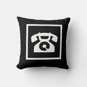 retro white phone on black pillow