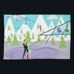 Retro Winter Ski Resort Kitchen Towel<br><div class="desc">This Retro Winter Ski Resort Kitchen Towel has something for everyone. The picturesque cartoon drawing features a snow-covered mountain range with green cedar trees. A lone skier, wearing red, orange, and royal blue, can be seen swooshing down the tallest mountain. Snow is continuing to fall from clouds in the turquoise...</div>