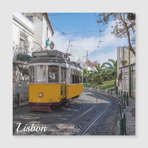 Retro yellow tram on street in Lisbon Portugal
