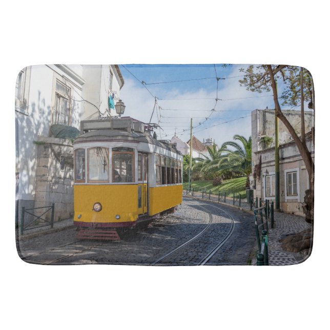 Retro yellow tram on street in Lisbon, Portugal Bath Mat (Front)