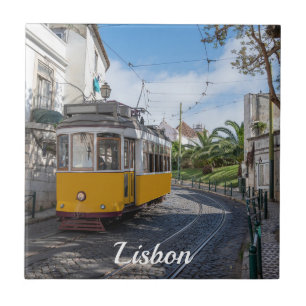 Retro yellow tram on street in Lisbon, Portugal Ceramic Tile