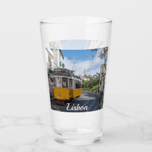 Retro yellow tram on street in Lisbon, Portugal Glass