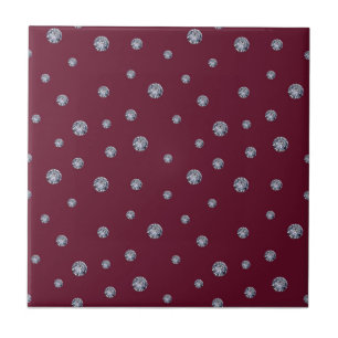 Rhinestones on dark red ceramic tile