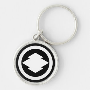 Rhombic pine bark in circle keychain