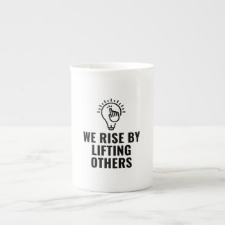 Rise by lifting others bone china mug