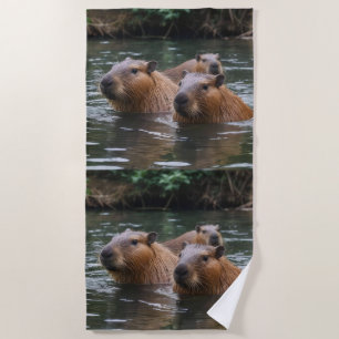 "River Serenity: Capybaras Swimming in the Flow" Beach Towel