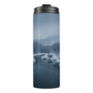 RIVER SURROUNDED BY SNOW COVERED FIELD WITH PINE T THERMAL TUMBLER