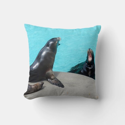Roar_roaring sea lions in turquoise water throw pillow
