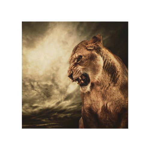 Roaring lioness against stormy sky wood wall art