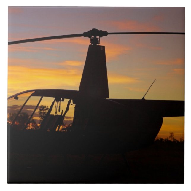 Robinson R44 helicopter at sunset Ceramic Tile (Front)