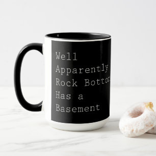 Rock Bottom Has a Basement on Black Mug