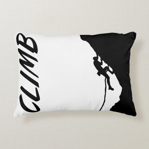 Rock climber conquers a sheer cliff  accent pillow