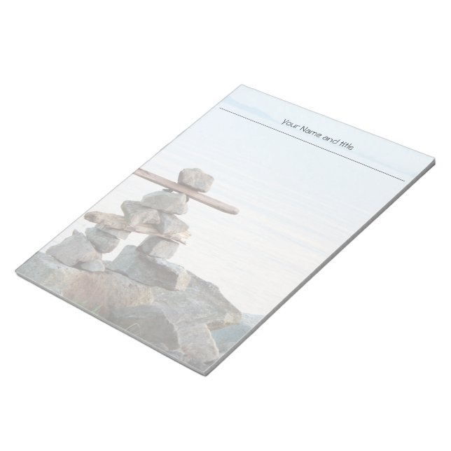 Rock stacking art by the beach. photo by Hao zhang Notepad (Angled)