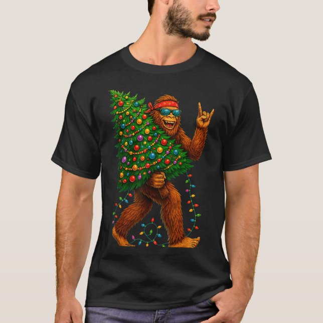 Rockin Christmas Bigfoot Carrying Tree Fun Xmas Ro T-Shirt (Front)