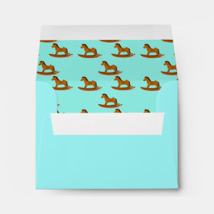 Rocking wooden horse pattern on blue envelope