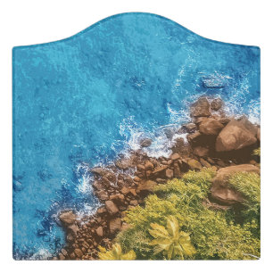Rocks in the sea, above view 1 door sign