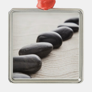 Rocks on sand metal ornament