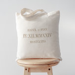 Roman Numeral Date, Names & City Wedding Welcome Tote Bag<br><div class="desc">These modern minimalist wedding tote bags make great bridal party gifts,  welcome bags,  or favors. Clean minimal design features your names and wedding city in modern neutral tan serif lettering. Your wedding date,  centered in large roman numerals,  adds a chic and unexpected touch.</div>