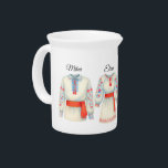 Romanian Roots Folk Costume Traditional Attire Beverage Pitcher<br><div class="desc">Celebrate Romanian heritage with this charming watercolor wallpaper featuring traditional folk costumes (ie and cămașă) for men and women,  adorned with red sashes and floral embroidery. The elegant “Romania” ribbon adds a nostalgic and patriotic touch. Perfect for cultural spaces,  ethnic-themed nurseries,  or heritage décor.</div>