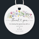 Romantic Boho Garden Wildflower Thank You Favor Tags<br><div class="desc">Add a heartfelt finishing touch to your wedding favors with these watercolor wildflower thank you tags. Featuring a spray of hand-painted blooms in pink, purple, yellow, and blue with elegant script that reads “thank you, ” this round tag is personalized with your names and wedding date. Perfect for attaching to...</div>