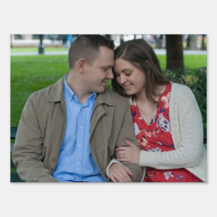 Romantic Couple Sitting Close Together Sign