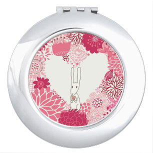 Romantic floral background with cute rabbit compact mirror